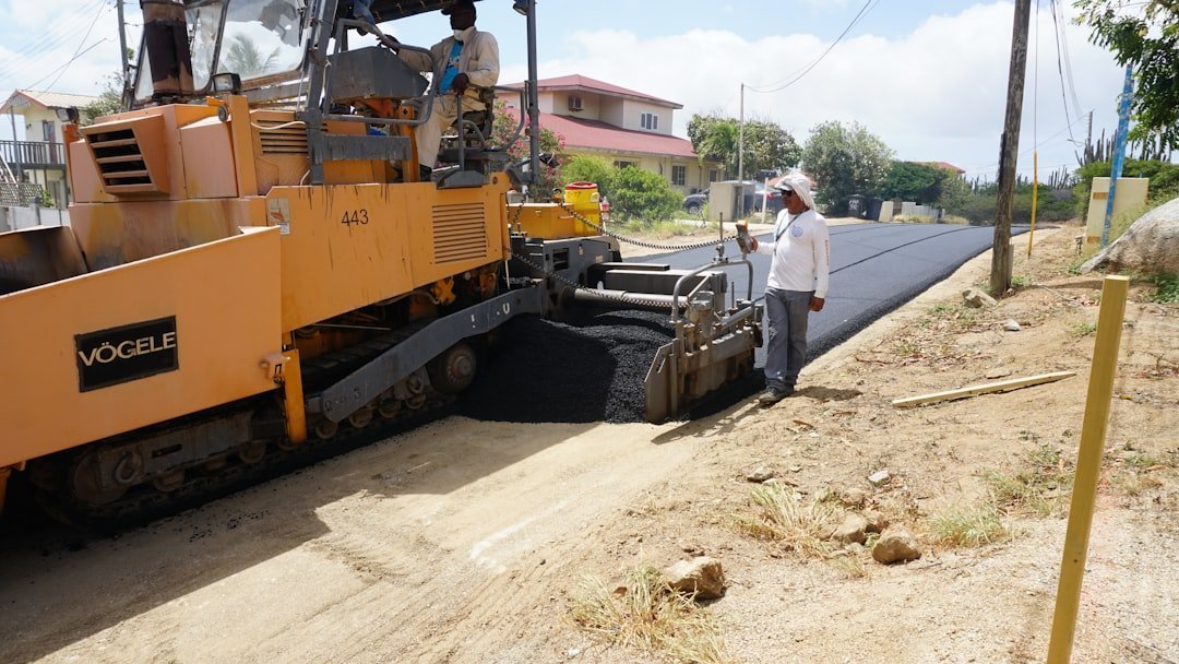 tiến độ Vịnh Tiên Vinhomes Cần Giờ — minh họa asphalt road paving construction site