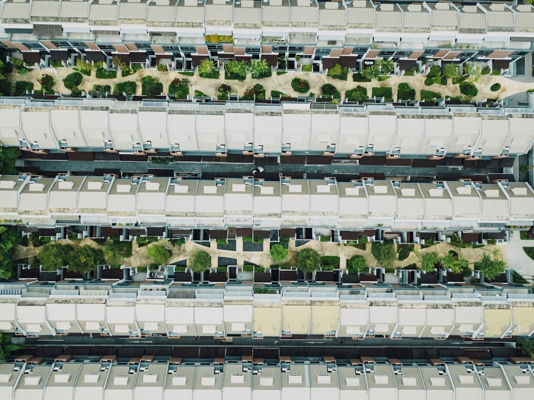 thuế nhà đất thứ hai — minh họa modern townhouses rooftops aerial real estate